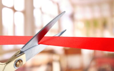 Grand opening, cutting red ribbon